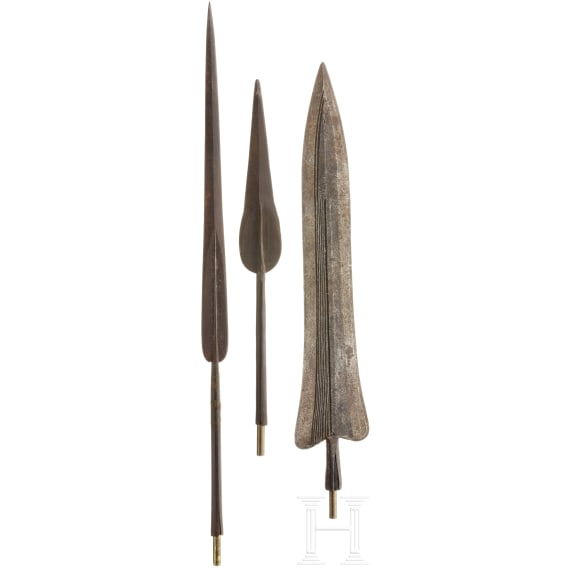Three African lance tips with a presentation stand