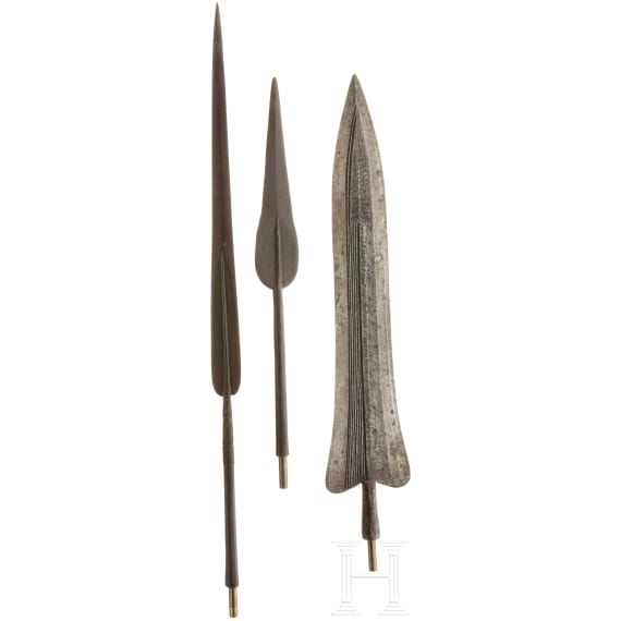 Three African lance tips with a presentation stand