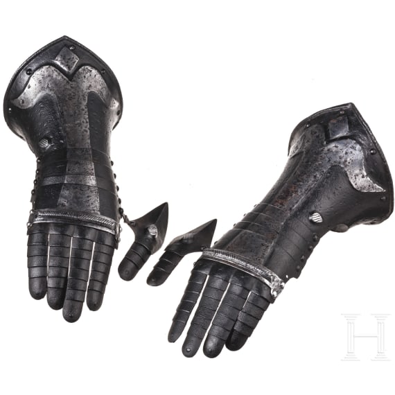 A pair of German black and white gauntlets, circa 1580