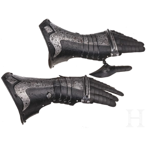 A pair of German black and white gauntlets, circa 1580