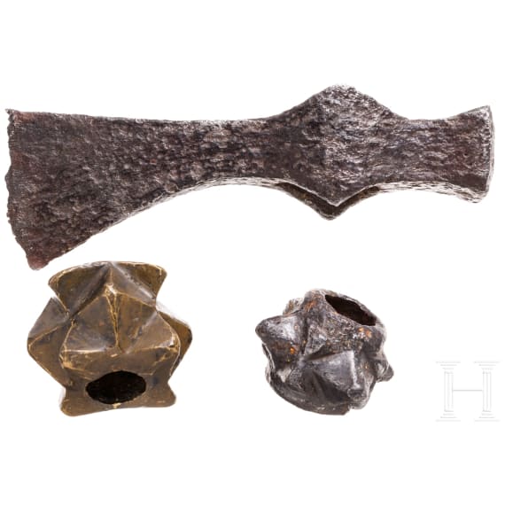 Two Eastern European mace heads and an axe, 12th/13th century