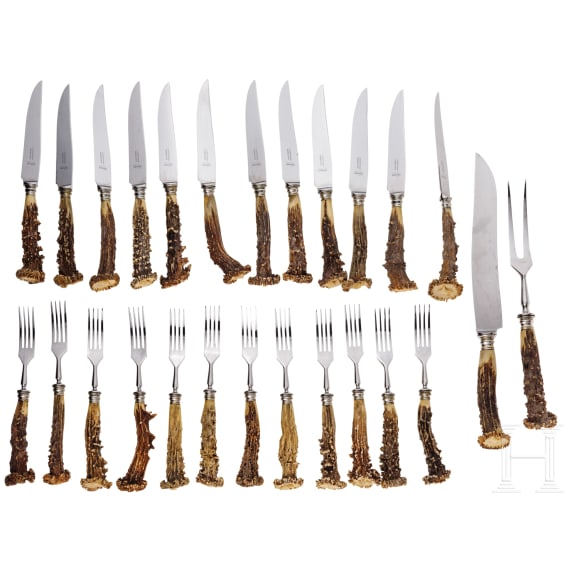 A carved German hunting cutlery set, Solingen, 20th century