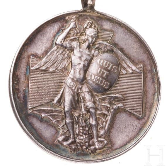 A silver medal of the Order of Merit of St. Michael