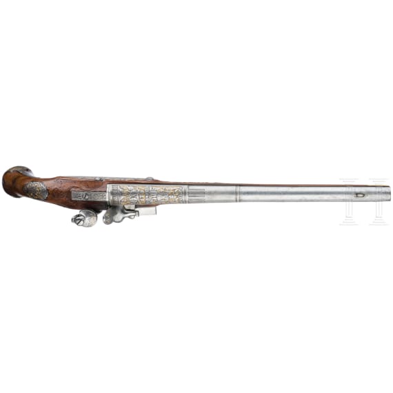 A magnificent pair of German chiselled flintlock pistols, circa 1780