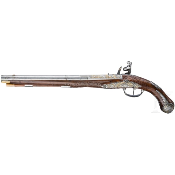 A magnificent pair of German chiselled flintlock pistols, circa 1780