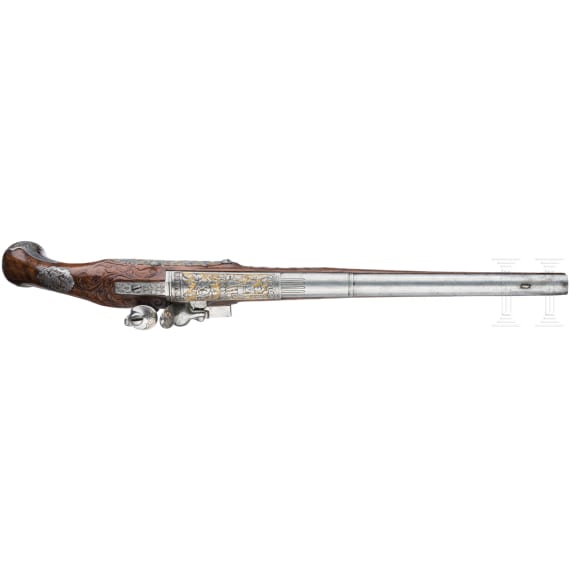 A magnificent pair of German chiselled flintlock pistols, circa 1780