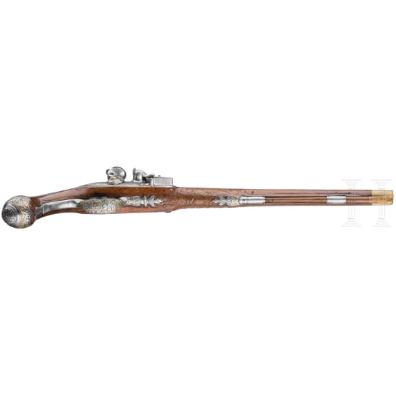 A magnificent pair of German chiselled flintlock pistols, circa 1780