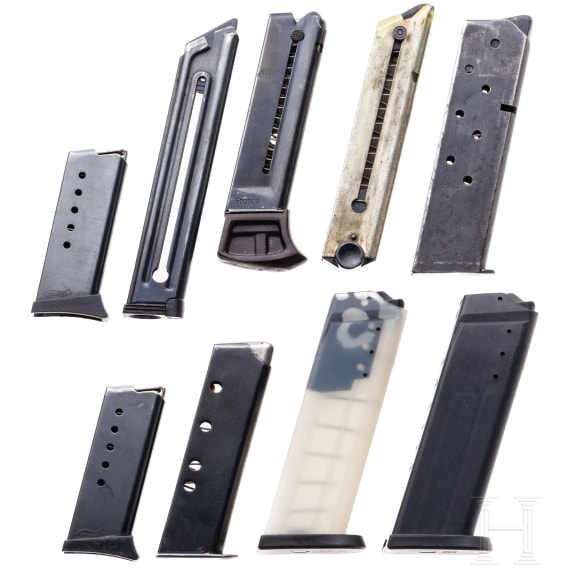 A mixed lot of nine pistol magazines
