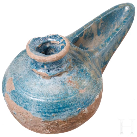 A selcuk pottery oil lamp, 14th - 16th century
