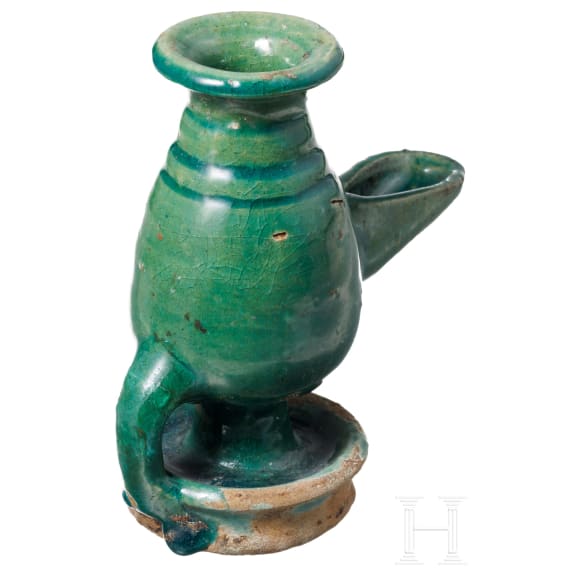 A selcuk pottery oil lamp, 14th - 16th century