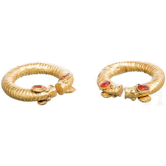 Two Greek golden curl rings with stylized animal heads, mid-4th century B.C.