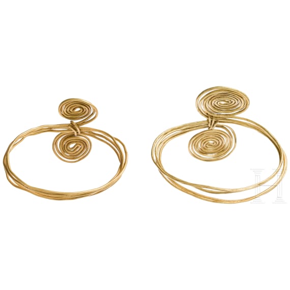 A pair of gold wire rings with four loops and spiral ends, late Urnfield Culture, 10th – 9th century B.C.