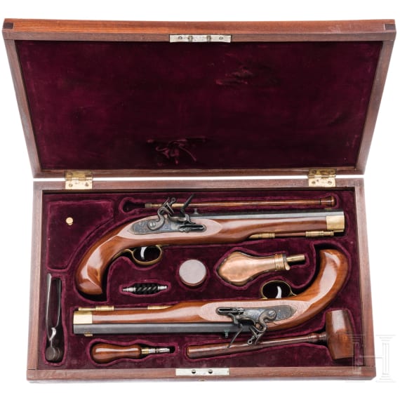 A pair of Italian flintlock pistols in a case, replicas, 20th century