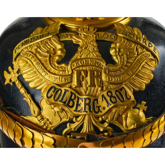 A helmet for Prussian Field Artillery Regiment 10 Officers with Colberg banner