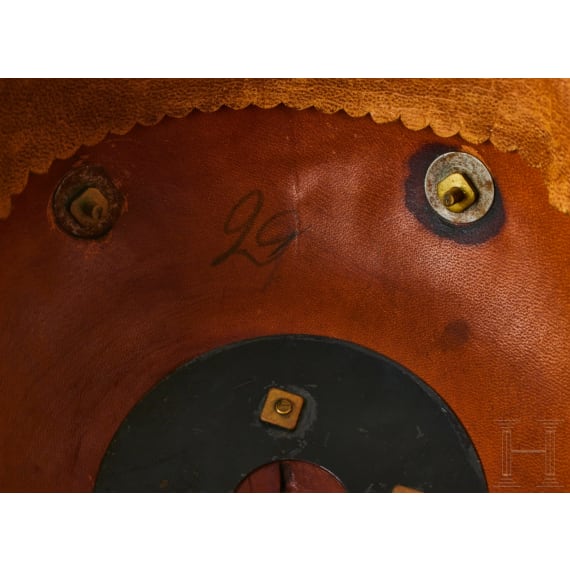 A helmet for Prussian Field Artillery Regiment 10 Officers with Colberg banner