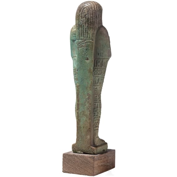 A faience ushabti with nine-line hieroglyphic inscription, 26th Dynasty (Saite Period), mid-1st millennium B.C.