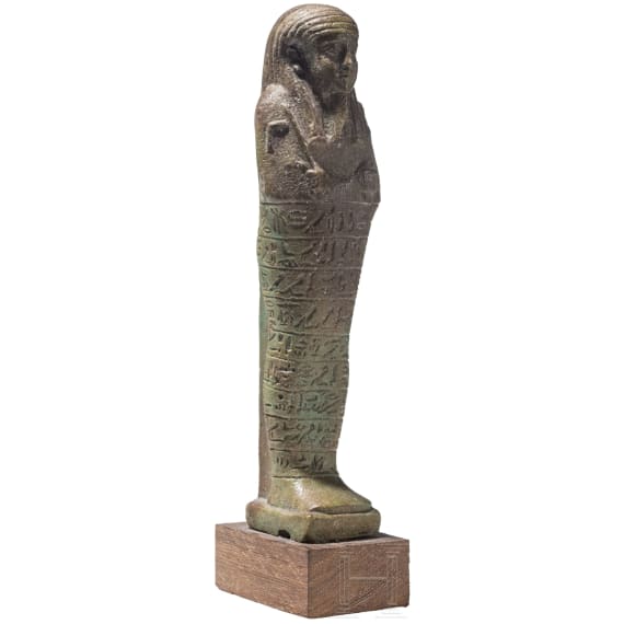 A faience ushabti with nine-line hieroglyphic inscription, 26th Dynasty (Saite Period), mid-1st millennium B.C.