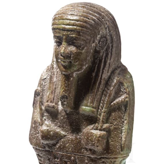 A faience ushabti with nine-line hieroglyphic inscription, 26th Dynasty (Saite Period), mid-1st millennium B.C.