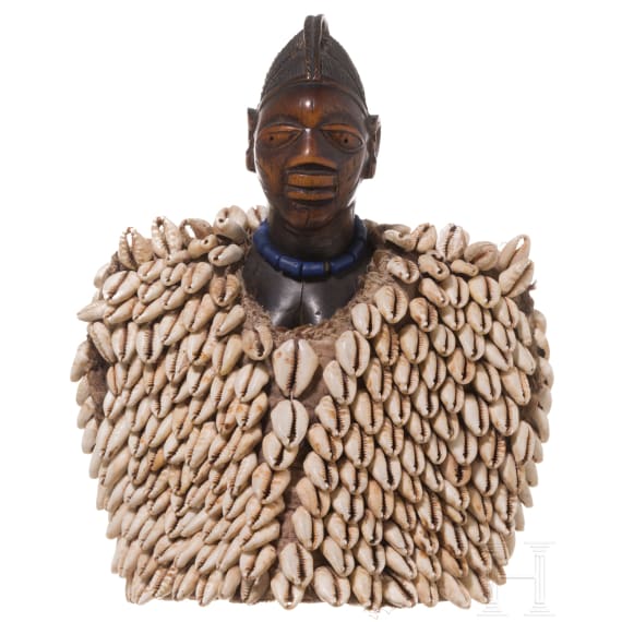 A Nigerian female twin figure (ere ibeji) of the Yewa in a cowry cloak, Nigeria, 20th century