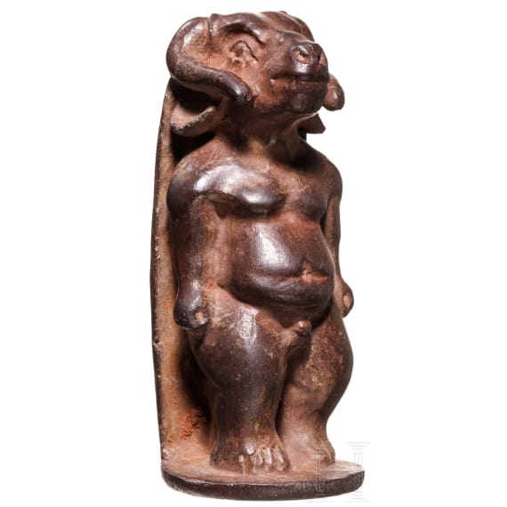 A bronze statuette of Chnum with grotesque features, Alexandrian, 1st century A.D.