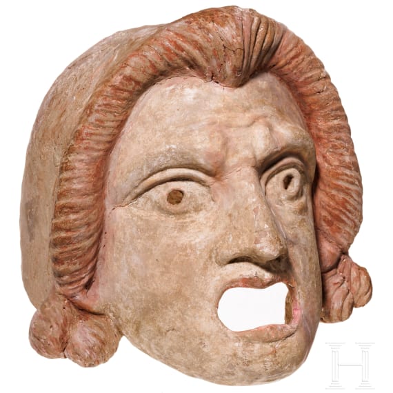 A Hellenistic terracotta theatre mask of the New Comedy, naive Ephebe type, 2nd century B.C.