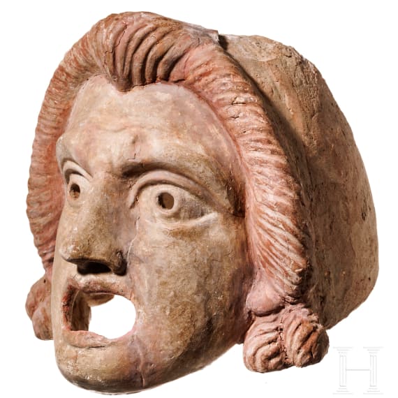 A Hellenistic terracotta theatre mask of the New Comedy, naive Ephebe type, 2nd century B.C.
