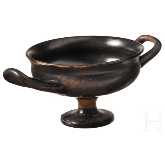 Two Greek bowls with handles made of black-glazed pottery, 4th century B.C.