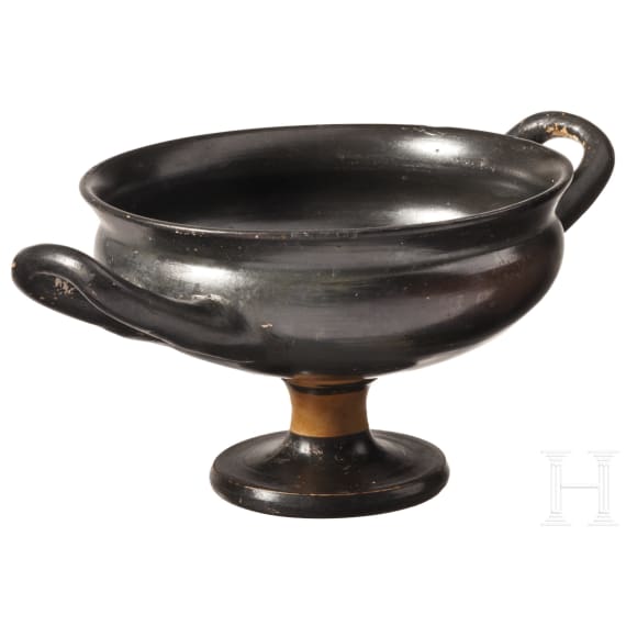 Two Greek bowls with handles made of black-glazed pottery, 4th century B.C.