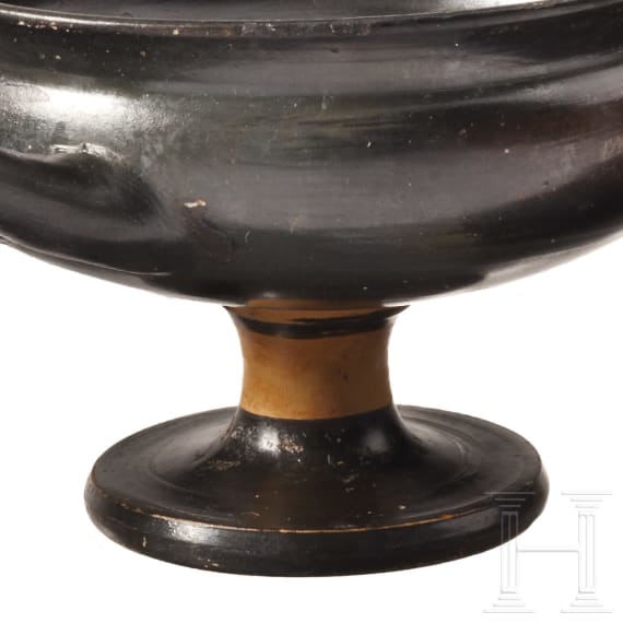 Two Greek bowls with handles made of black-glazed pottery, 4th century B.C.