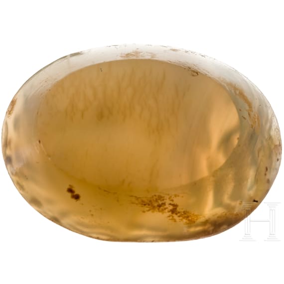 A Greek agate stone gem with Poseidon in biga drawn by two hippokamps, 4th century B.C.