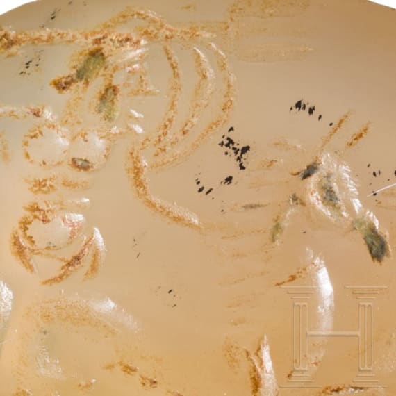 A Greek agate stone gem with Poseidon in biga drawn by two hippokamps, 4th century B.C.