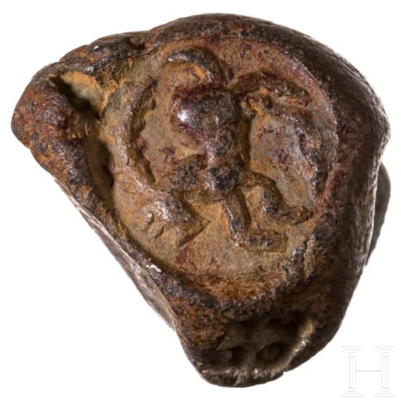 Five impressions of seals on clay, a clay model and a bronze punch with bird of prey, Greek, late antique and early Islamic, 3rd century B.C. - 8th century A.D.