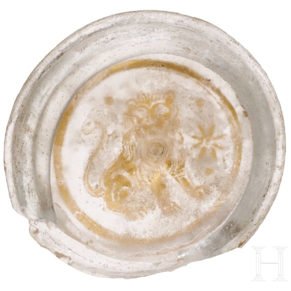 A Roman glass fragment with "Zwischengoldglas" technique from the bottom of a vessel, 3rd century A.D.