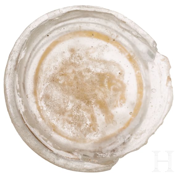 A Roman glass fragment with "Zwischengoldglas" technique from the bottom of a vessel, 3rd century A.D.