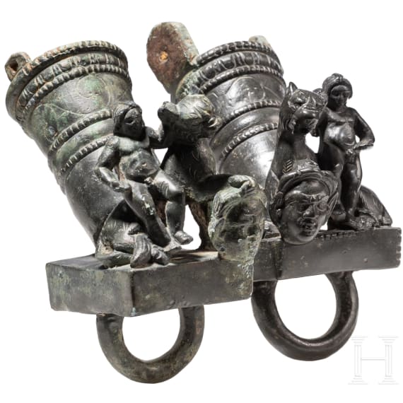 Two Roman mirror-like yoke fittings with Eros on panther and satyr mask, bronze, late 1st - mid-3rd century A.D.