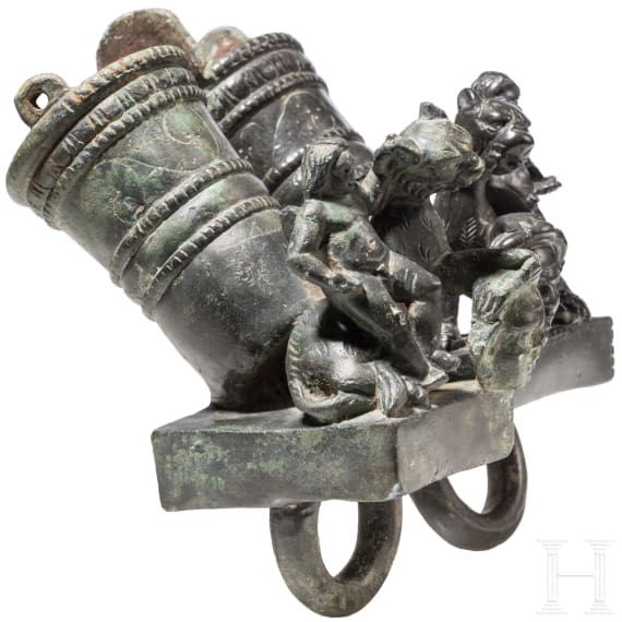 Two Roman mirror-like yoke fittings with Eros on panther and satyr mask, bronze, late 1st - mid-3rd century A.D.