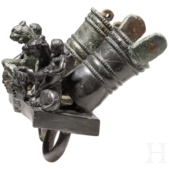 Two Roman mirror-like yoke fittings with Eros on panther and satyr mask, bronze, late 1st - mid-3rd century A.D.