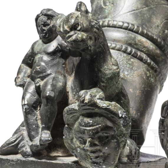 Two Roman mirror-like yoke fittings with Eros on panther and satyr mask, bronze, late 1st - mid-3rd century A.D.