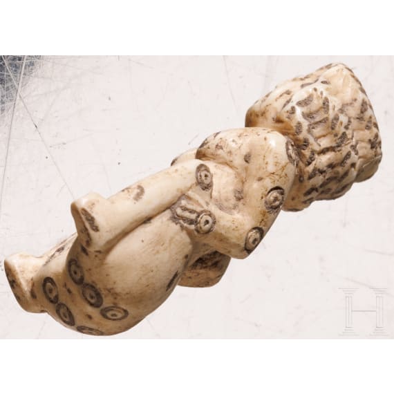 A Roman erotic gambling bone dice in the shape of a squatting woman, 2nd - 3rd century A.D.