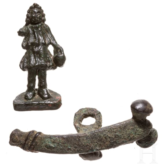 A Roman miniature statuette of a Lar and phallic amulet, 2nd - 3rd century A.D.