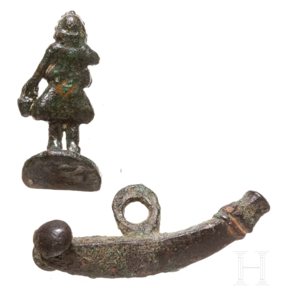A Roman miniature statuette of a Lar and phallic amulet, 2nd - 3rd century A.D.