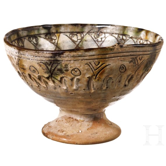 A Middle Byzantine glazed bowl with ring stand, sgraffito ware, 11th century A.D.