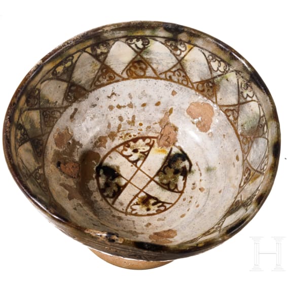 A Middle Byzantine glazed bowl with ring stand, sgraffito ware, 11th century A.D.