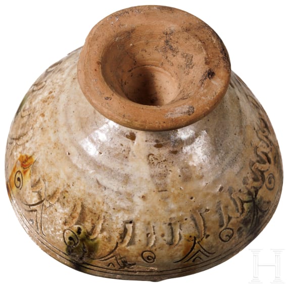 A Middle Byzantine glazed bowl with ring stand, sgraffito ware, 11th century A.D.