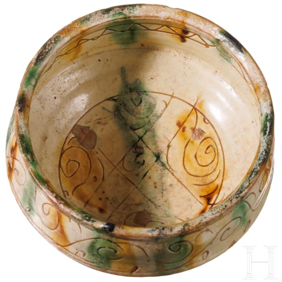 A late Byzantine bowl with coloured glaze and ring stand, 12th - 14th century A.D.