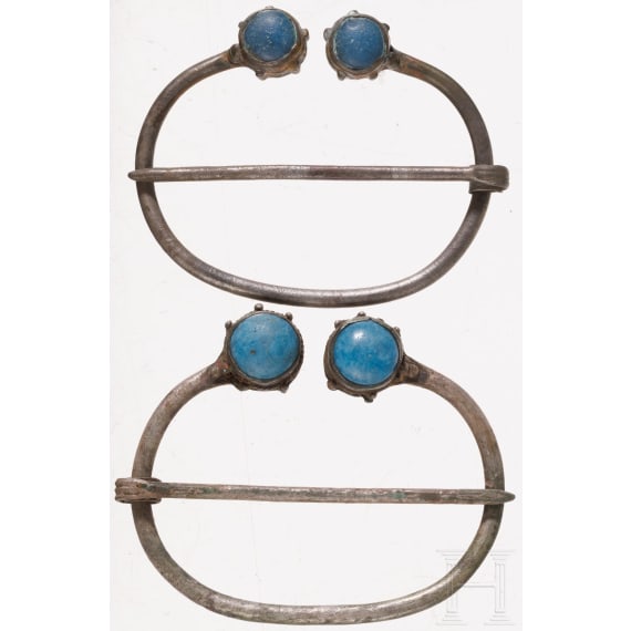 A pair of Finno-Ugric ring brooches made of silver with blue glass inlays, 10th - 11th century