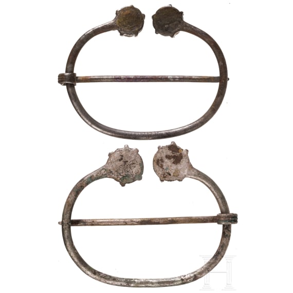 A pair of Finno-Ugric ring brooches made of silver with blue glass inlays, 10th - 11th century