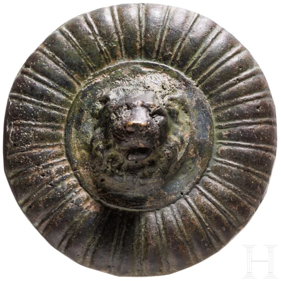 A solid bronze appliqu&eacute; with a central lion head based on an antique model, 19th century