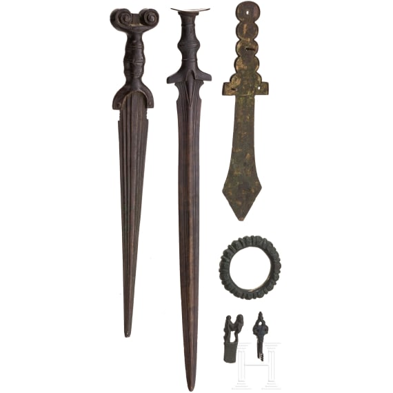 Five replicas of various antiquities including two bronze swords and an East Asian ritual dagger