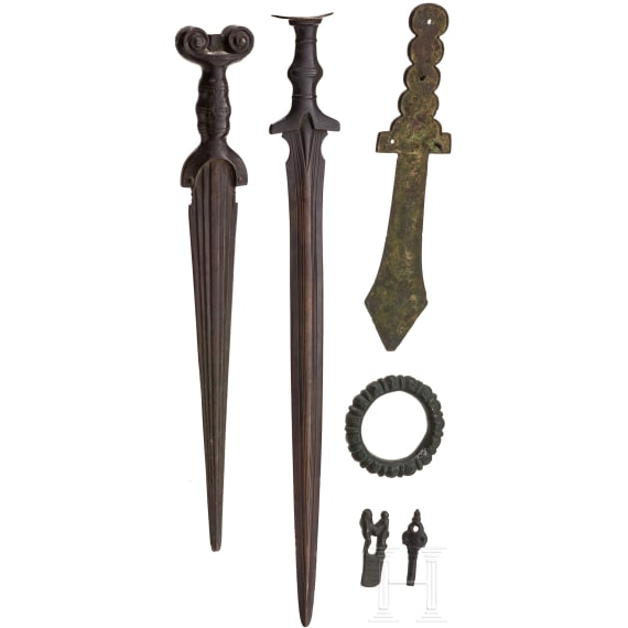 Five replicas of various antiquities including two bronze swords and an East Asian ritual dagger